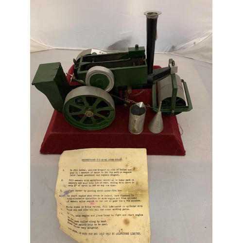 202 - A VINTAGE SELFRIDGES LTD MODEL STEAM ROLLER  WITH MINI FUNNEL, JUG AND INSTRUCTION SHEET - MODEL IS ... 