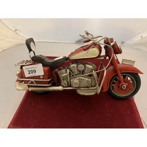 209 - A TINPLATE RED MODEL MOTORBIKE