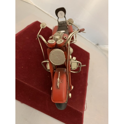 209 - A TINPLATE RED MODEL MOTORBIKE