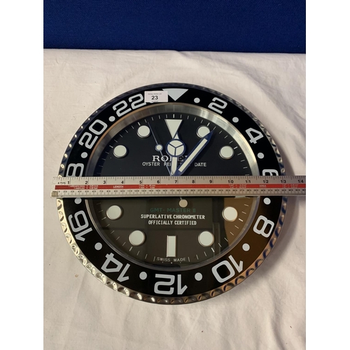 23 - A DEALERS WALL CLOCK