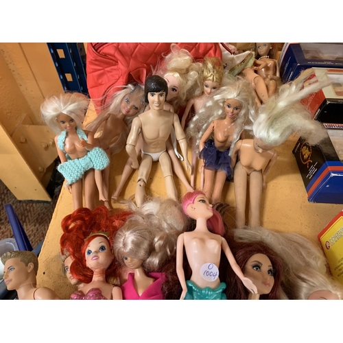 233 - AN ASSORTMENT OF BARBIE DOLLS TO INCLUDE TWO MERMAID BARBIES