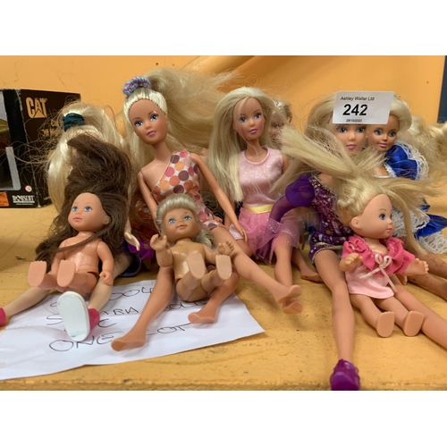 242 - AN ASSORTMENT OF VARIOUS DOLLS TO INCLUDE SIMBA ETC