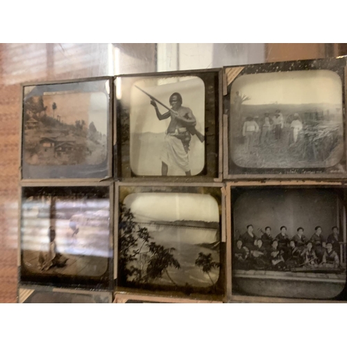 35 - A VINTAGE WOODEN BOX CONTAINING VICTORIAN GLASS SLIDES