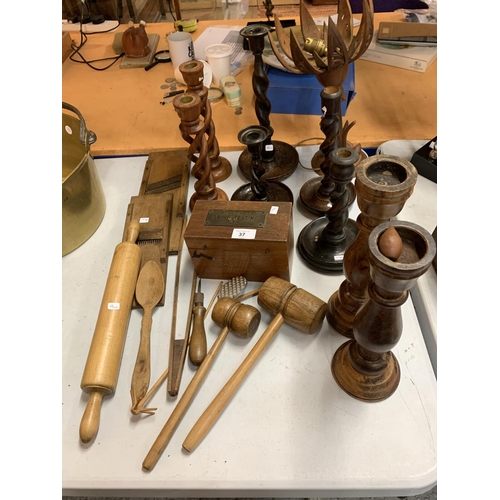 37 - A LARGE QUANTITY OF WOODEN ITEMS TO INCLUDE SEVERAL CANDLESTICKS