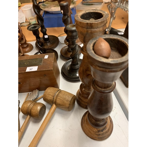 37 - A LARGE QUANTITY OF WOODEN ITEMS TO INCLUDE SEVERAL CANDLESTICKS