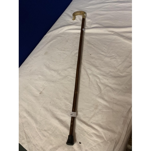 41 - A WOODEN WALKING STICK WITH ANIMAL HORN HANDLE