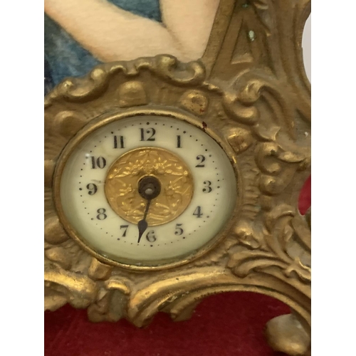 61 - A BRASS ART NOUVEAU MANTLE CLOCK