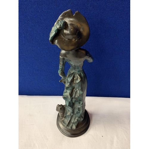 7 - AN SPELTER EDWARDIAN STYLE FIGURINE OF A LADY AND HER DOG