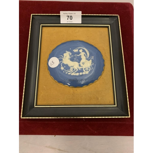 70 - A FRAMED BLUE AND WHITE OVAL PLAQUE WITH VELVET BACKING