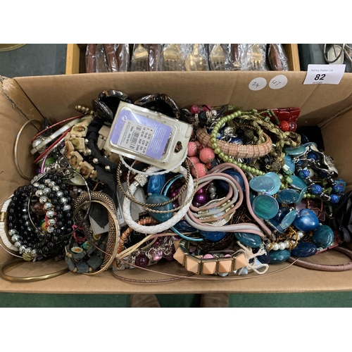 82 - A LARGE BOX OF ASSORTED COSTUME JEWELLERY