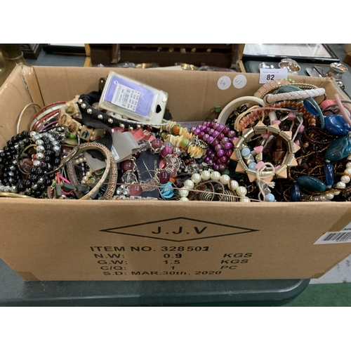 82 - A LARGE BOX OF ASSORTED COSTUME JEWELLERY