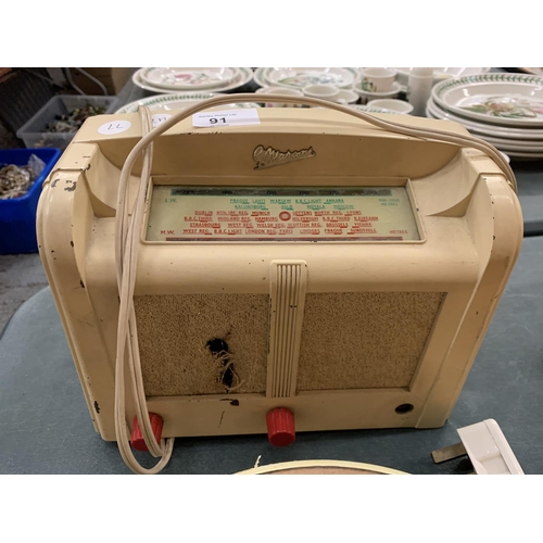 91 - A VINTAGE BAKELITE WHITE AND RED HANDLED RADIO