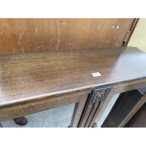 1846 - AN EARLY 20TH CENTURY TWO DOOR OAK CABINET WITH GLAZED DOORS, 36