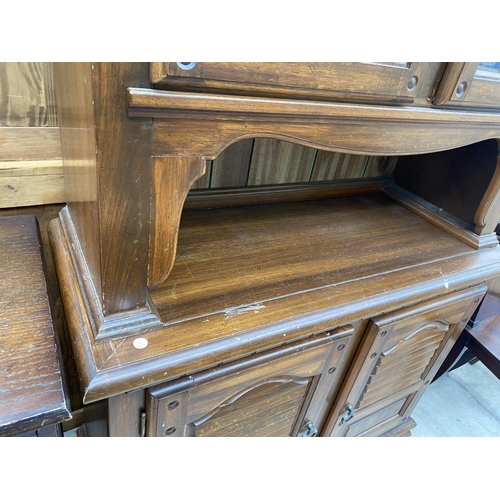 1850 - A MODERN HARDWOOD DRESSER WITH GLAZED UPPER PORTION AND SHAM LOUVRE DOORS TO BASE, 42