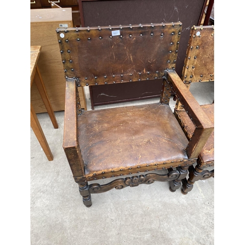 1857 - A SET OF SIX CARVED OAK DINING CHAIRS WITH STUDDED LEATHER SEATS AND BACKS (INCLUDING ONE CARVER)