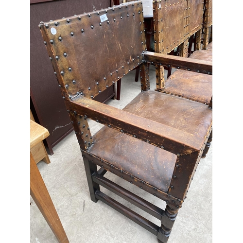 1857 - A SET OF SIX CARVED OAK DINING CHAIRS WITH STUDDED LEATHER SEATS AND BACKS (INCLUDING ONE CARVER)