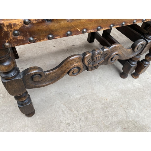 1857 - A SET OF SIX CARVED OAK DINING CHAIRS WITH STUDDED LEATHER SEATS AND BACKS (INCLUDING ONE CARVER)