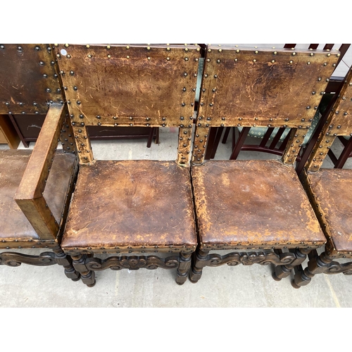 1857 - A SET OF SIX CARVED OAK DINING CHAIRS WITH STUDDED LEATHER SEATS AND BACKS (INCLUDING ONE CARVER)