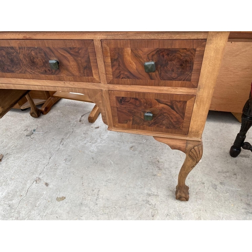 1877 - A MID 20TH CENTURY WALNUT DRESSING TABLE ON BALL AND CLAW FEET