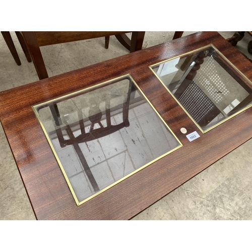 1882 - A MODERN GLASS TOPPED COFFEE TABLE