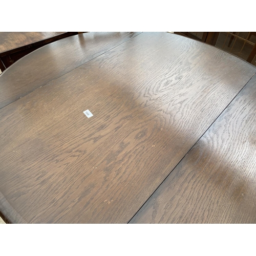 1886 - A PRIORY CORNER OAK DROP-LEAF DINING TABLE (52x45