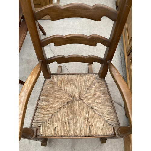 1894 - A SMALL WALNUT SEWING BOX ON CABRIOLE LEGS AND A RUSH SEATED CHILDS ROCKER