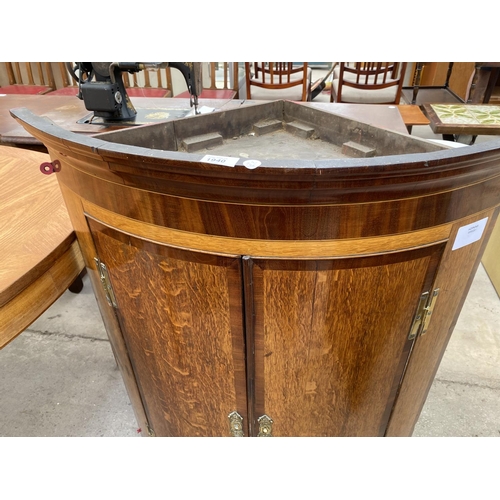 1940 - A GEORGE III OAK AND CROSSBANDED BOWFRONT CORNER CUPBOARD WITH H BRASS HINGE, 30