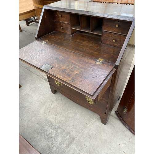 1941 - A GEORGE III STYLE OAK BUREAU WITH FITTED INTERIOR AND THREE GRADUATED DRAWERS, 30