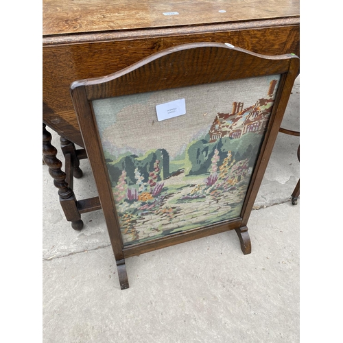 1948 - AN EARLY 20TH CENTURY OVAL OAK GATELEG TABLE ON BARLEYTWIST LEGS TOGETHER WITH A TAPESTRY FIRE SCREE... 