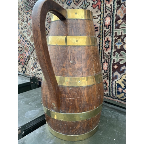 1207 - A LARGE WOODEN BARRELL JUG WITH BRASS BINDINGS, HEIGHT 42CM