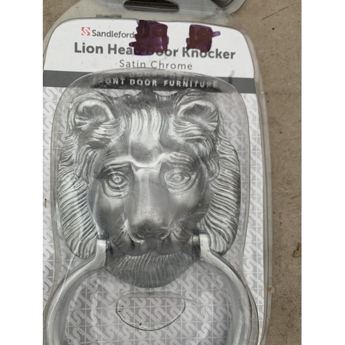 1303 - THREE NEW AND BOXED CHROME LION HEAD DOOR KNOCKERS