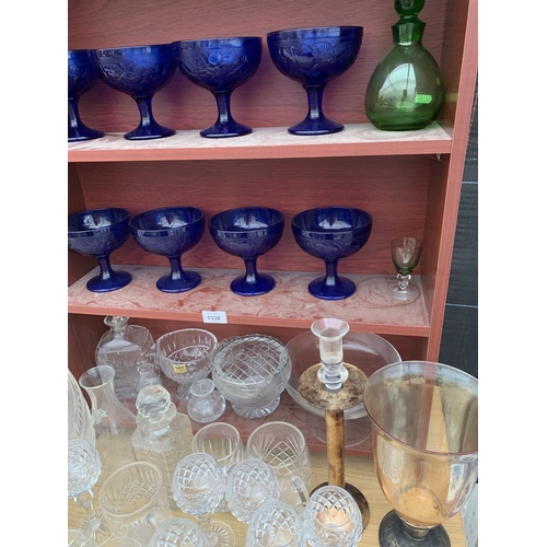 1338 - A LARGE QUANTITY OF GLASSWARE TO INCLUDE DECANTERS, WINE GLASSES, BLUE COBALT GLASSES ETC.