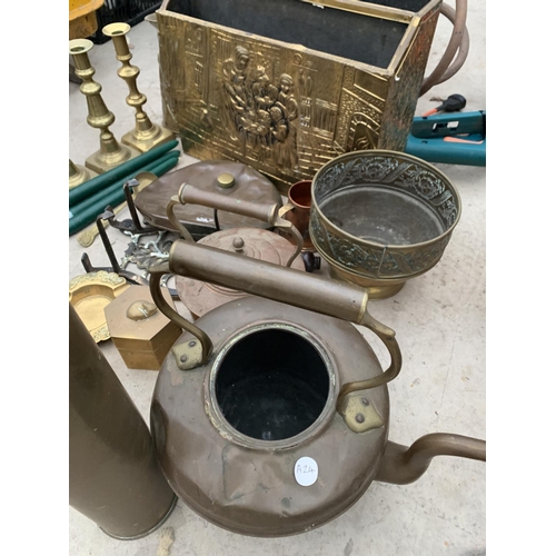 1386 - A LARGE QUANTITY OF BRASS AND COPPER ITEMS TO INCLUDE KETTLES, CANDLE STICKS ETC.