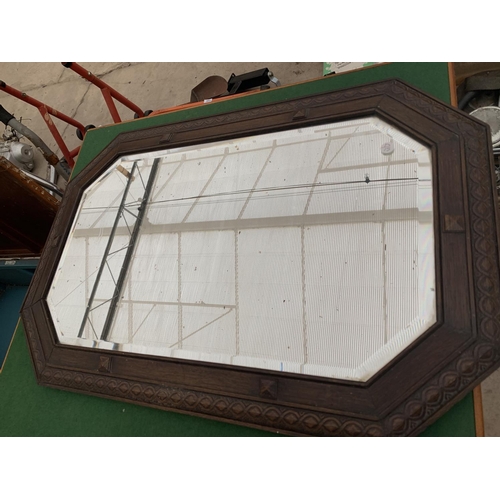 1396 - A FOLDING CARD TABLE TOGETHER WITH AN ORNATE BEVELLED WOODEN FRAMED MIRROR