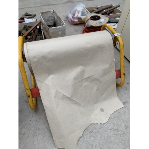 1402 - A METAL FRAMED BROWN PAPER PACKING ROLL DISPENSER