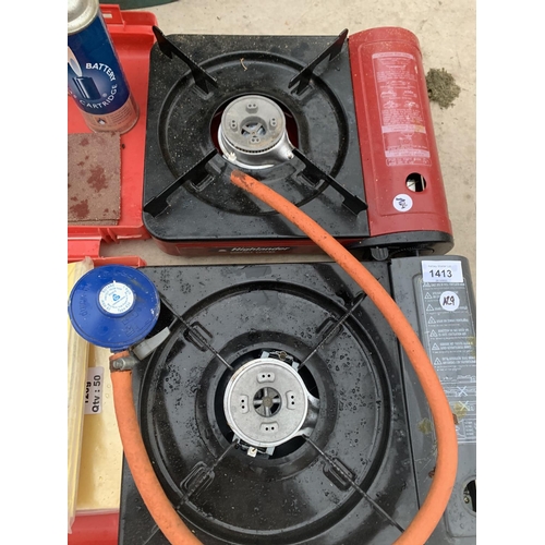 1413 - TWO CAMPING GAS STOVES, CARTRIDGES AND ABRASIVE PAPER