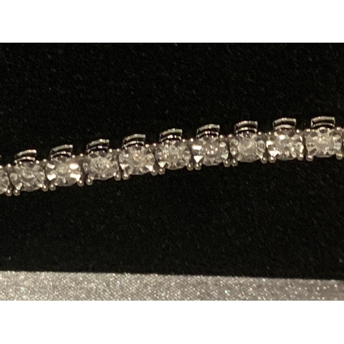 502 - A 9 CARAT WHITE GOLD AND DIAMOND LADIES TENNIS BRACELET. DIAMOND WEIGHT BELIEVED TO BE 2 - 3 CARAT