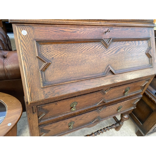 2138 - AN EARLY 20TH CENTURY OAK BUREAU BOOKCASE ON TURNED LEGS, BARLEYTWIST FRONT STRETCHER, HAVING GLAZED... 