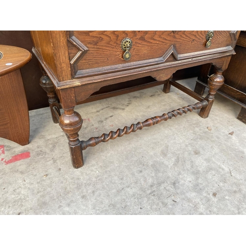 2138 - AN EARLY 20TH CENTURY OAK BUREAU BOOKCASE ON TURNED LEGS, BARLEYTWIST FRONT STRETCHER, HAVING GLAZED... 