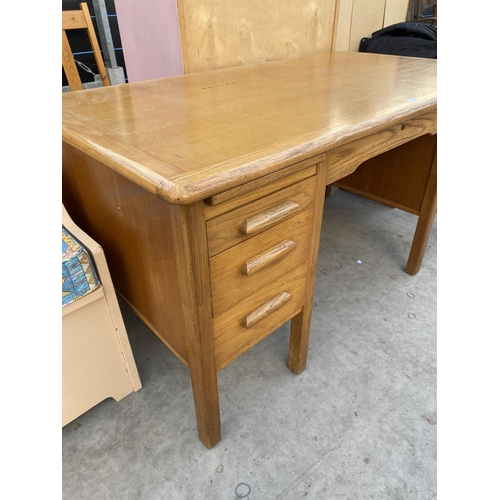 2146 - A MID 20TH CENTURY LIGHT OAK ABBESS ENDURING WOODWARE TWIN PEDESTAL DESK ENCLOSING SIX DRAWERS AND T... 