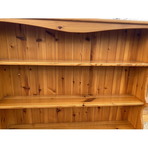 2150 - A MODERN PINE DRESSER COMPLETE WITH PLATE RACK, 47