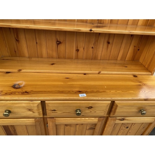 2150 - A MODERN PINE DRESSER COMPLETE WITH PLATE RACK, 47