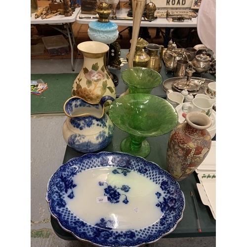 107 - AN ASSORTMENT OF DECORATIVE VASES TO ALSO INCLUDE A LARGE BLUE AND WHITE JUG AND PLATTER