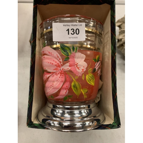 130 - A FLOWER PAINTED GLASS VASE WITH METAL BASE