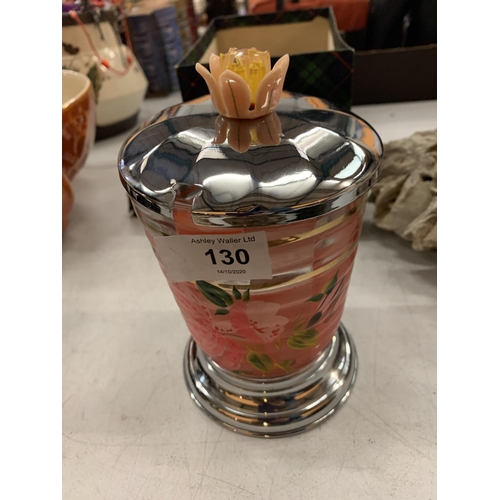 130 - A FLOWER PAINTED GLASS VASE WITH METAL BASE