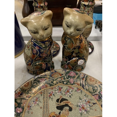 143 - A SET OF ORIENTAL WARE TO INCLUDE PLATE, CANDLESTICKS AND TWO CAT ORNAMENTS