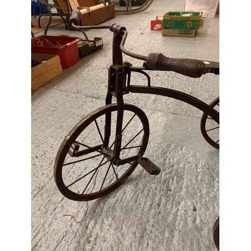 177 - A VINTAGE WOODEN AND METAL CHILDS TRICYCLE