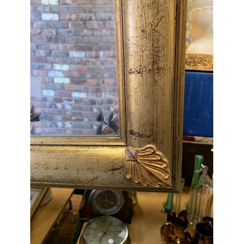 185 - A GILT FRAMED RECTANGULAR MIRROR