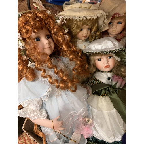 317 - SIX PORCELAIN HEADED DOLLS TO INCLUDE ONE WITH PIGTAILS ON SCOOTER