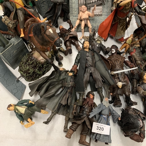 320 - A COLLECTION OF LORD OF THE RINGS ACTION FIGURES INCLUDING HELMS DEEP AND ACCESSORIES